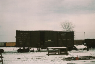 36. Car jacked up for repairs on the repair tracks, North Proviso, C & NW RR [i.e. Chicago and North Western railroad] Chicago, Illinois, 1942 / Jack Delano