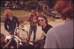 09. Motorcyclist Loading His Possession on a Truck with the Help of His Friends at Leakey, Texas, near San Antonio, 05/1973. Photographer: Marc St. Gil