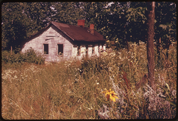 61. Abandoned House near Land Strip Mined by Coal Companies near the Intersection of Interstate 70 and Route #800, and Morristown, Ohio. 07/1974. Photographer: Erik Calonius