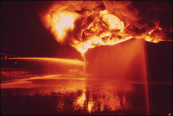 19.  Texaco Crude Oil Tank Blazes Against the Night after Being Struck by Lightning, 09/1972. Photographer: Jim Olive