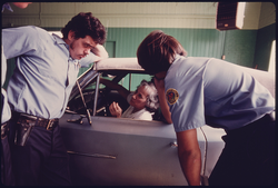 74. Unhappy Motorist Learns That Her Car Has Failed the Test at an Auto Emission Inspection Station at Norwood, Ohio, 08/1975. Photographer: Lyntha Scott Eiler