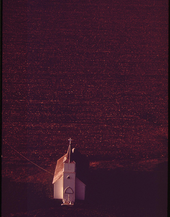 17. Abandoned church at dusk on north side of Interstate 80, May 1973. Photographer: Charles O'Rear